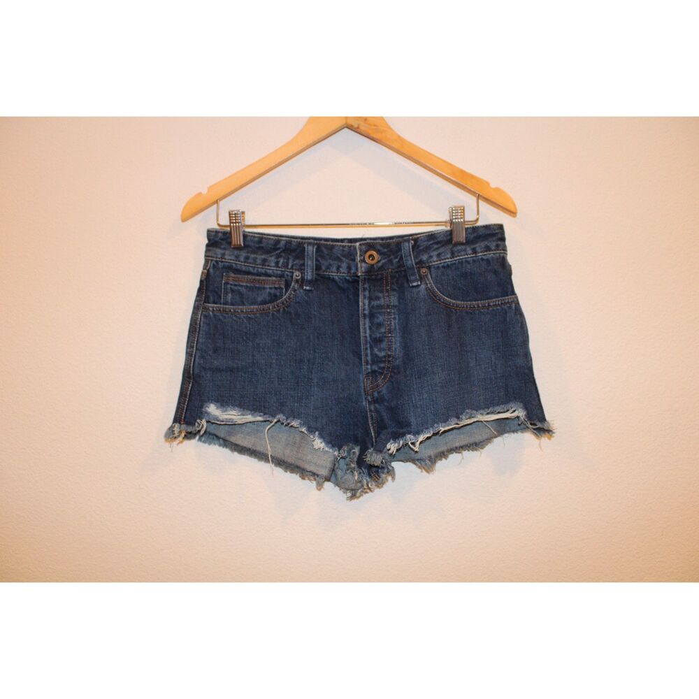 Free People medium wash denim cut off jean shorts size 28